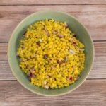 Herb Israeli Cous Cous in a green bowl