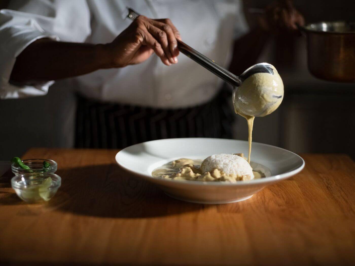 Chef plating thai green curry