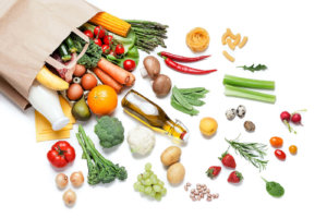 Vegetables coming out of a paper bag