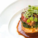 A mother sauce on the bottom of an entree plate