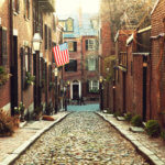 quaint view of a narrow Boston cobblestone street in Beacon Hill