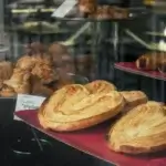 A display of palmiers in the window display of a bakery.