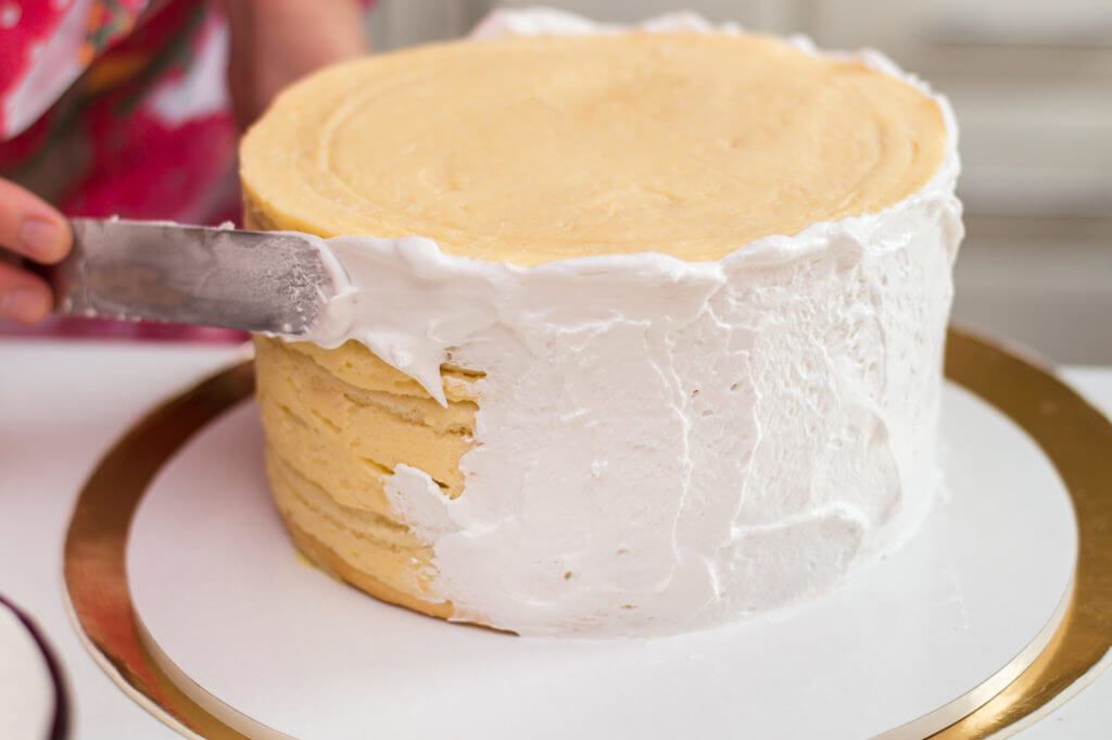 White icing placed on a cake