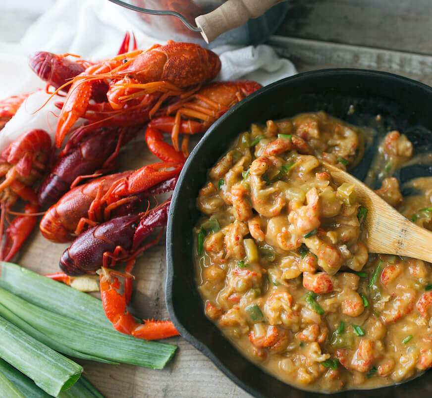 crawfish etouffee and blond roux in a cast iron skillet