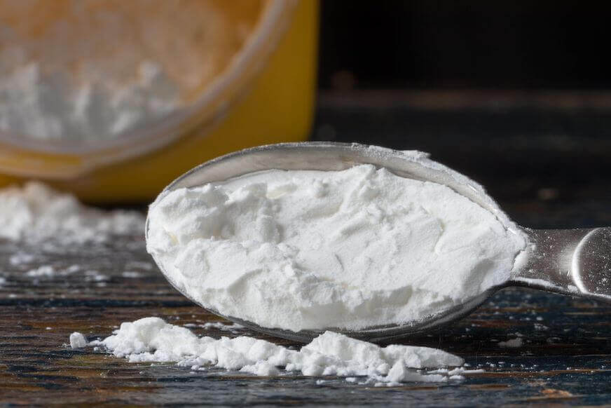 Cornstarch in a metal measuring cup