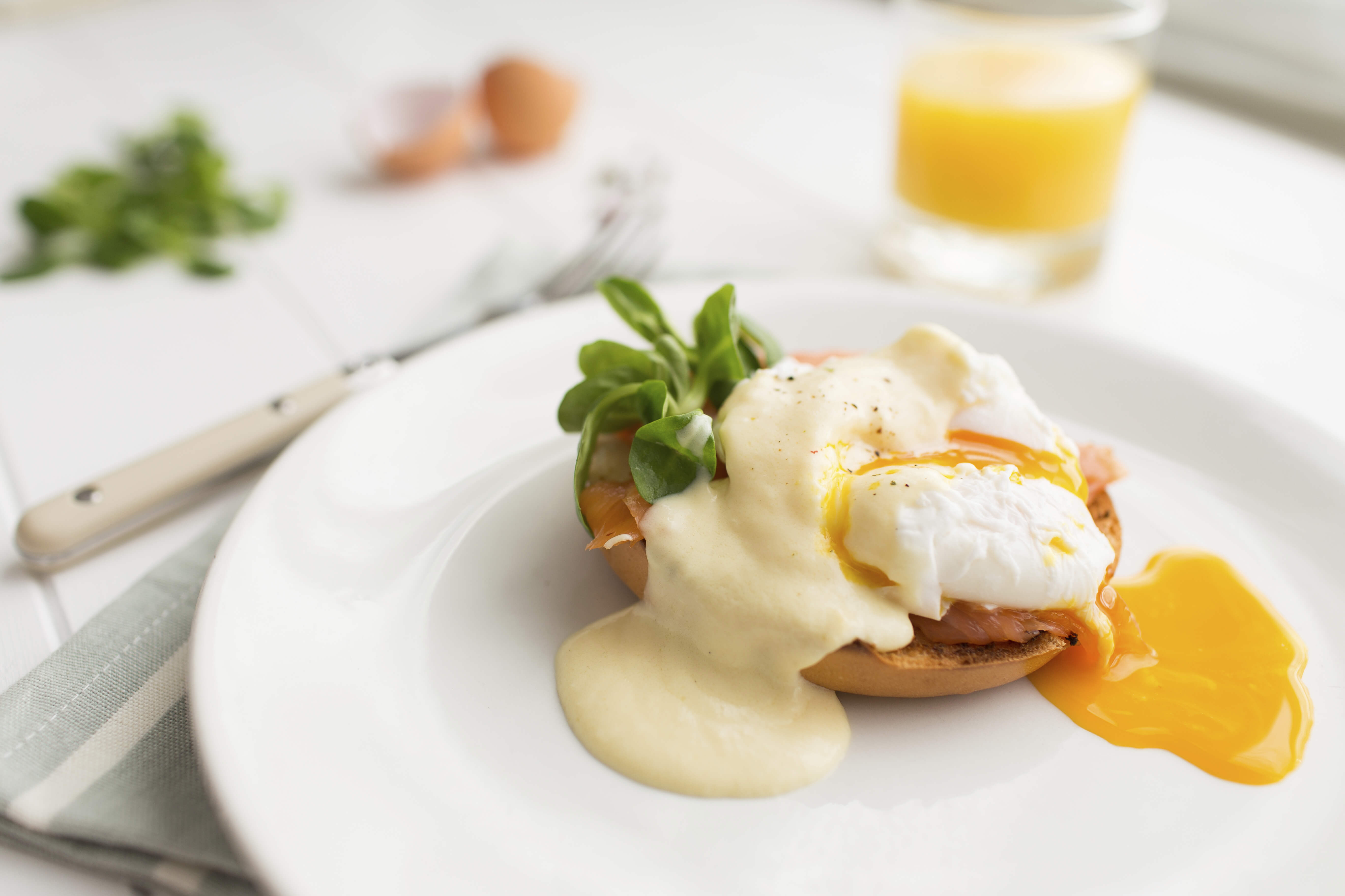 A typical brunch dish: poached eggs royale and orange juice. 