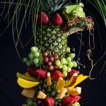 This decorative pineapple centerpiece is a gorgeous way to serve fruit.