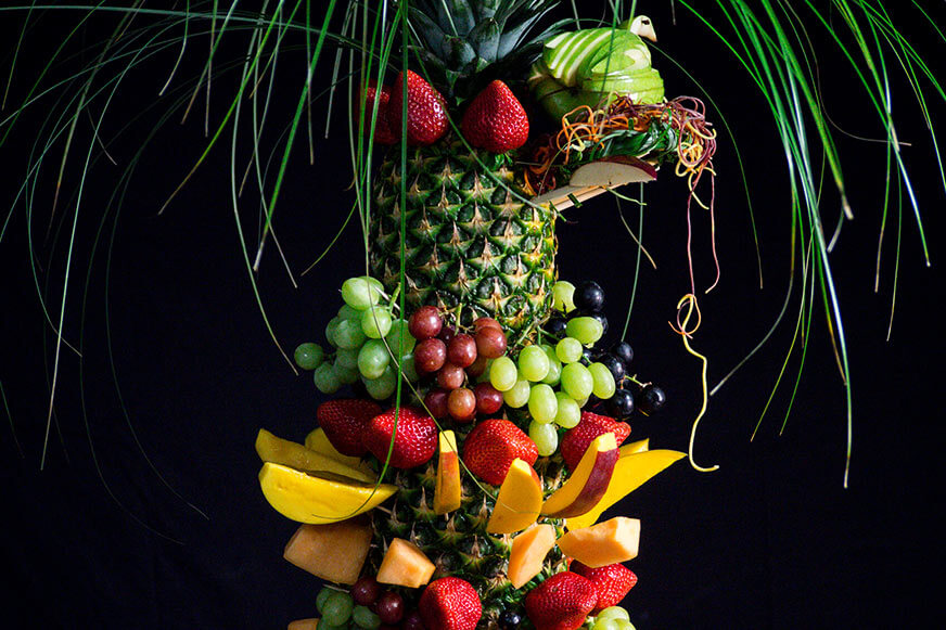 This decorative pineapple centerpiece is a gorgeous way to serve fruit.