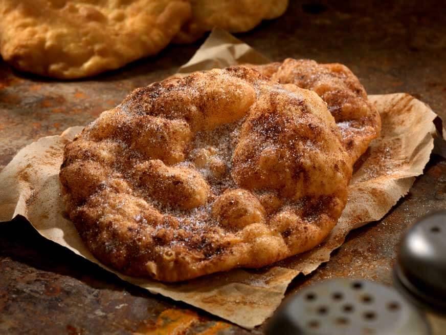 Bunuelos are essentially fried tortillas with powered sugar.