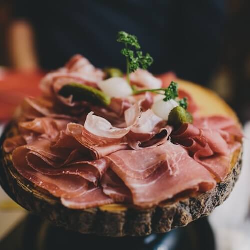 Bring together a delightful assortment of salami, ham and other cured meats.