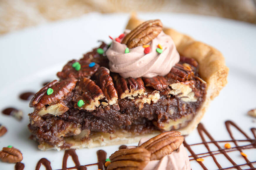 Adding chocolate to pecan pie makes this classic dessert extra decadent.