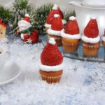 Straberries atop cupcakes make mini Santa hats for your family to enjoy.