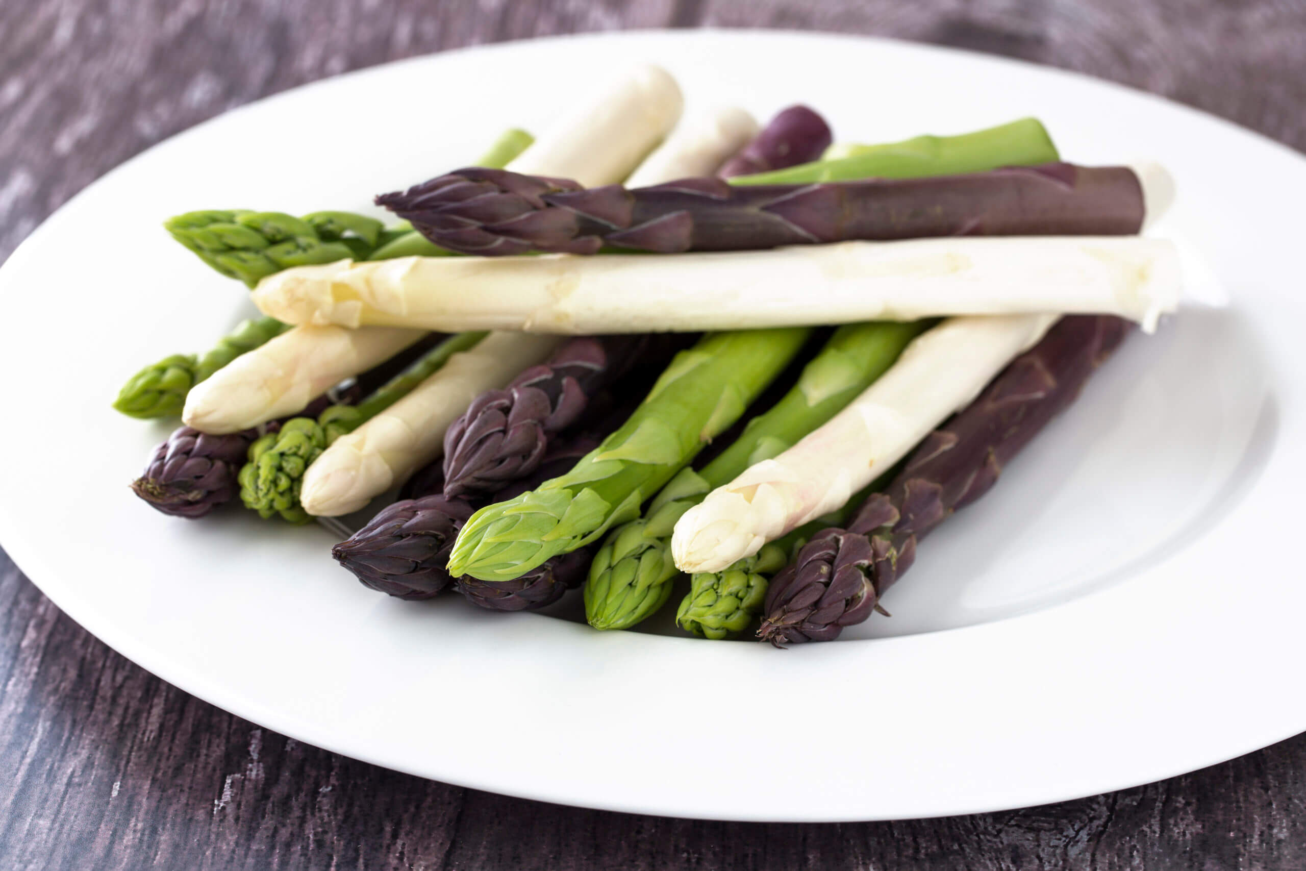 White, Green and Purple Asparagus on White Plate