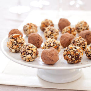 Chocolate Truffles displayed on a white pedestal platter