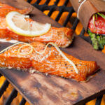 Three Grilled Salmon Filets on Cedar Plank