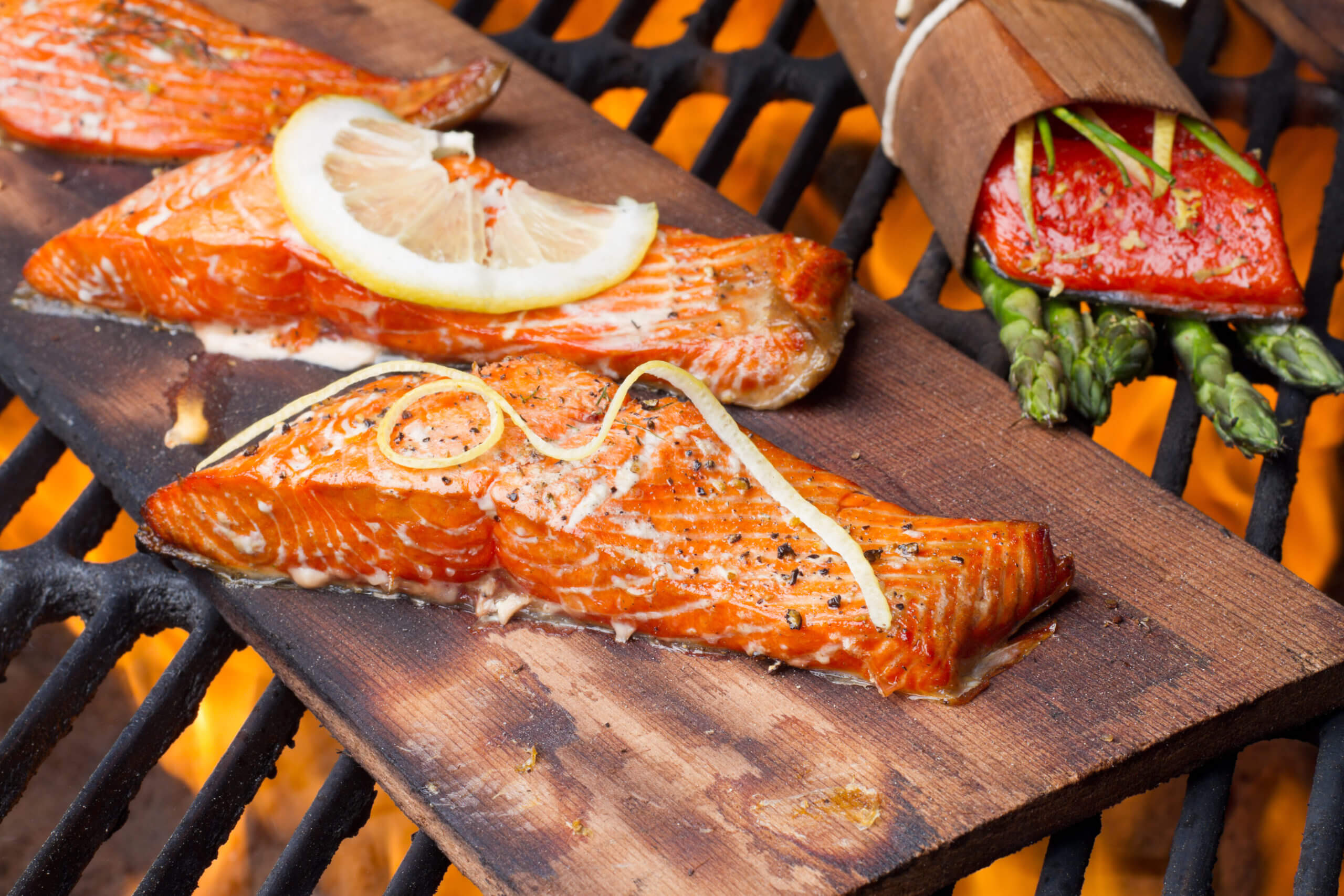 Three Grilled Salmon Filets on Cedar Plank
