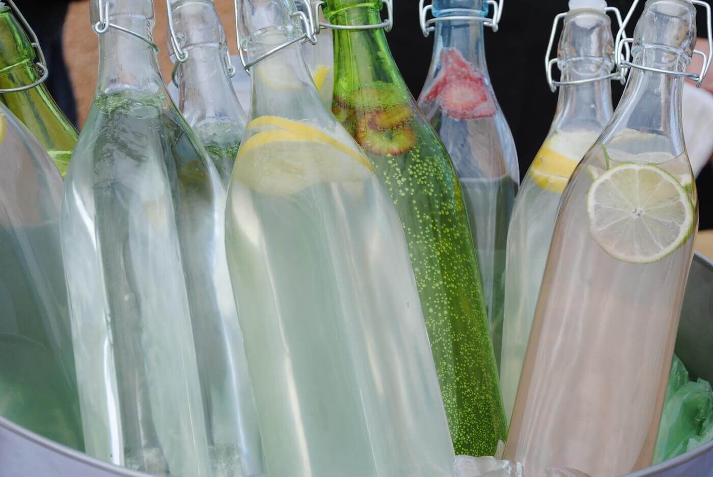 Glass soda bottles with lemons, lime and strawberries-2