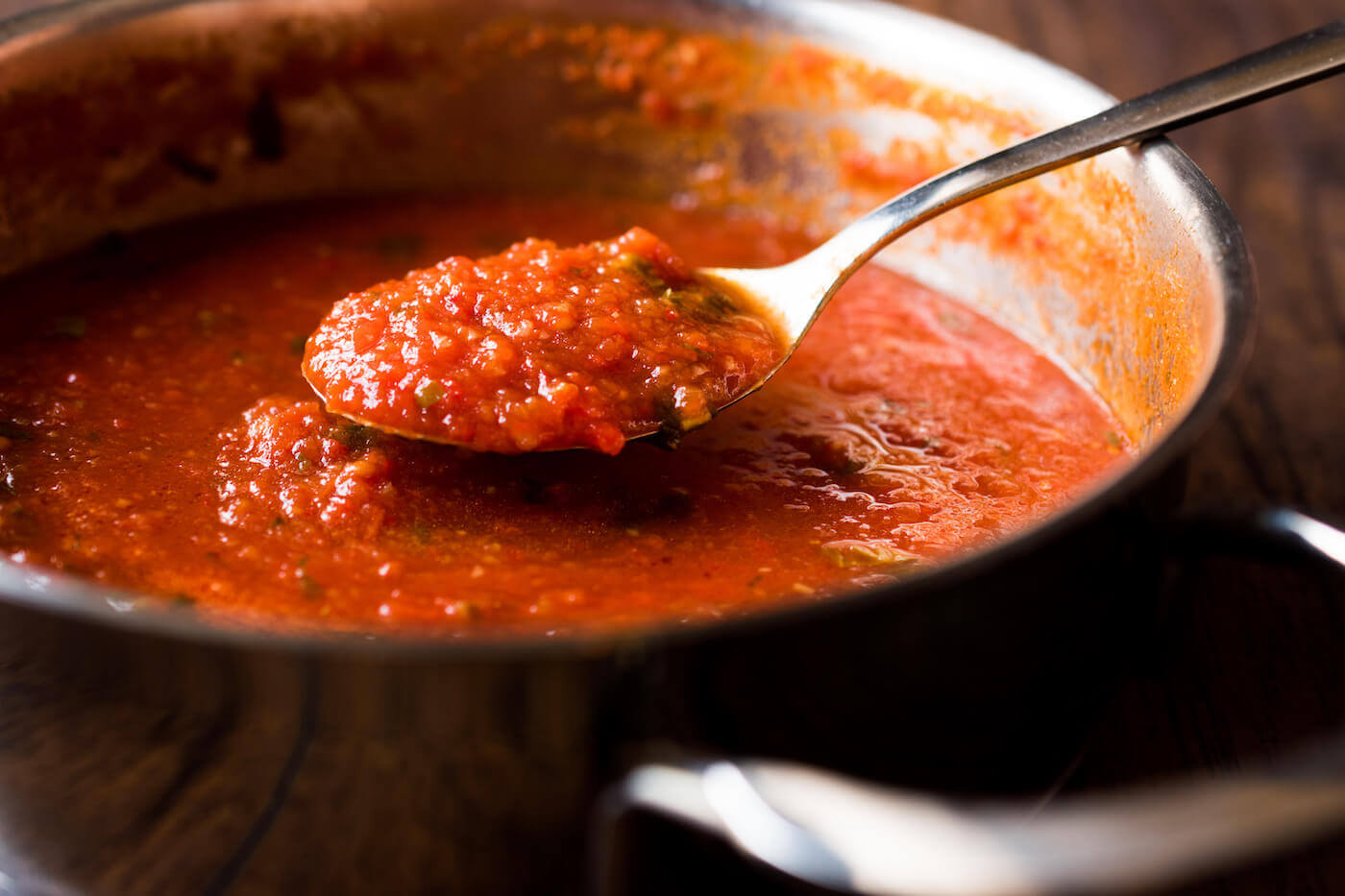 Tomato Sauce with Spoon in Metal Pan