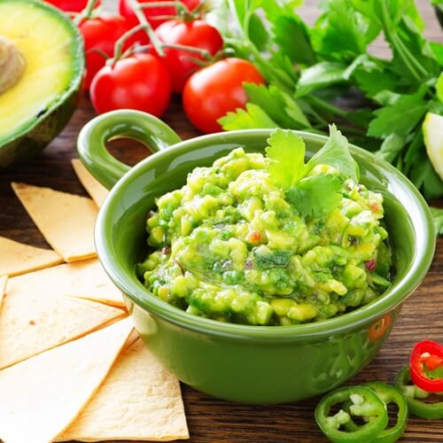 Add your favorite peppers and spices to your guacamole.