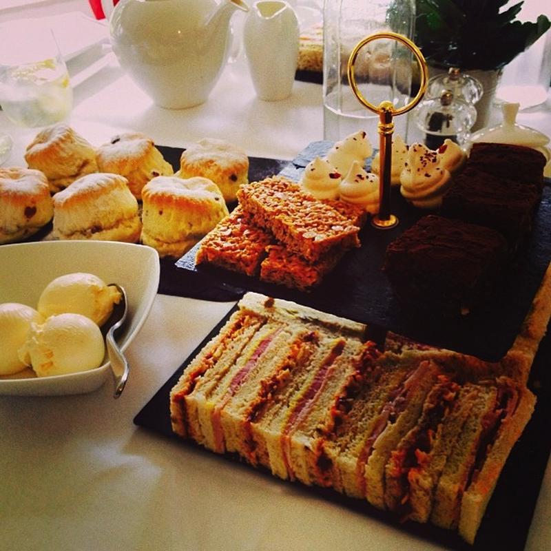 Oat bars and other snacks are spread out for tea time.