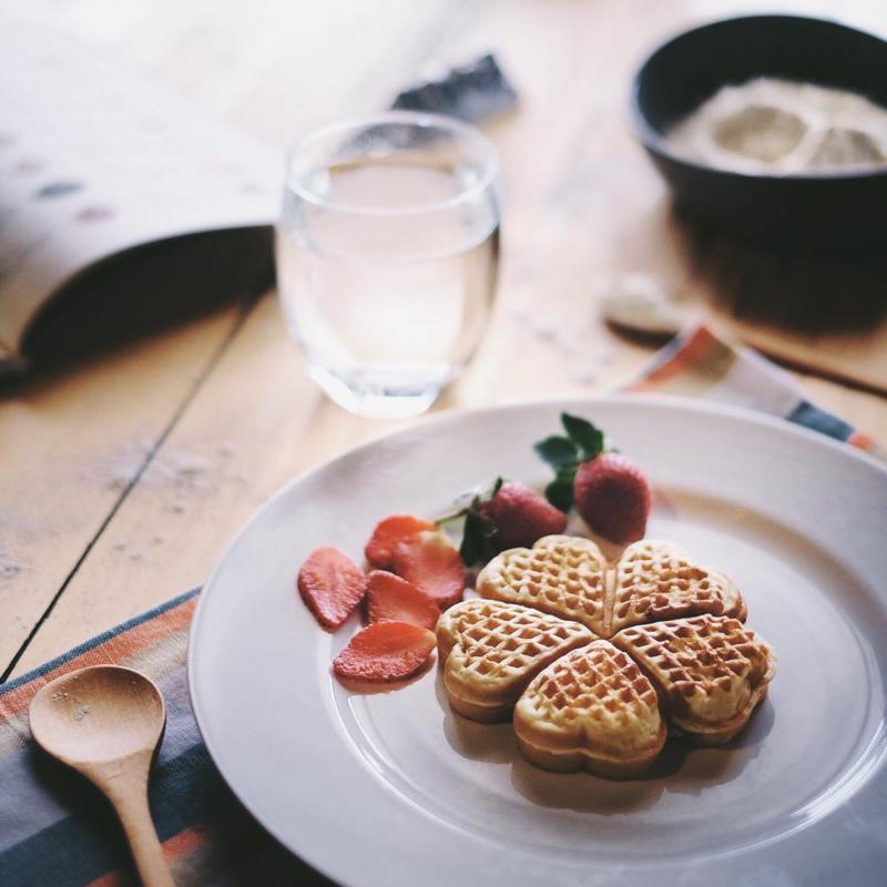 Heart-shaped waffles on a plate.