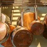 Create your own rack for pots and pans using a curtain rod or an old ladder. You’ll have easier access to your cookware and more storage for other items.
