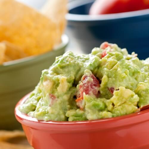 Spice up your guacamole by adding interesting ingredients.